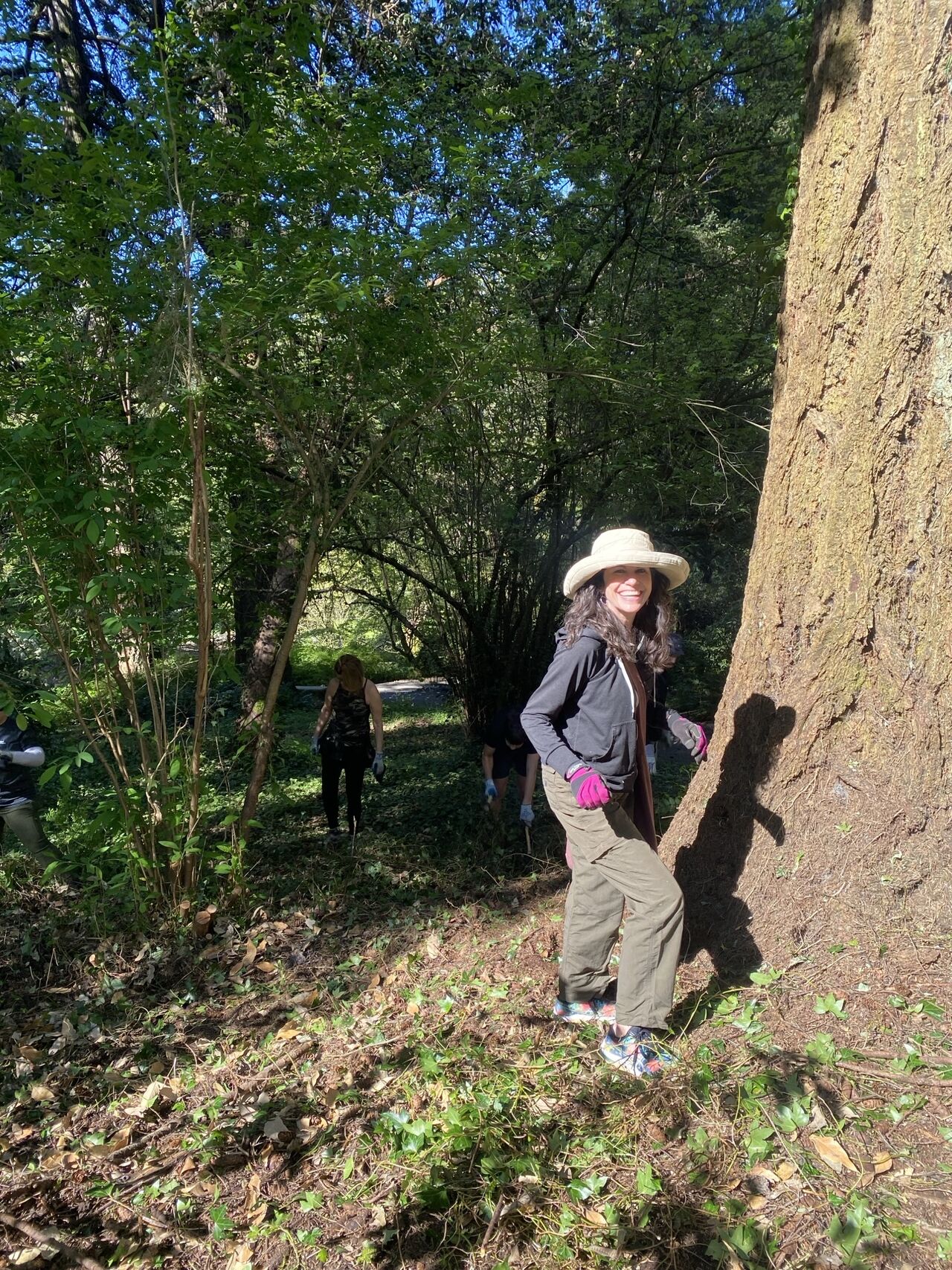 woman volunteering by tree
